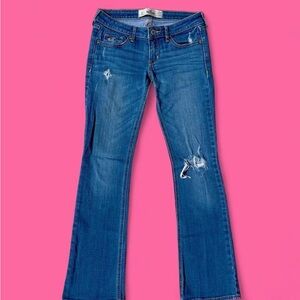 hollister medium wash low rise lightly distressed straight leg flare jeans!